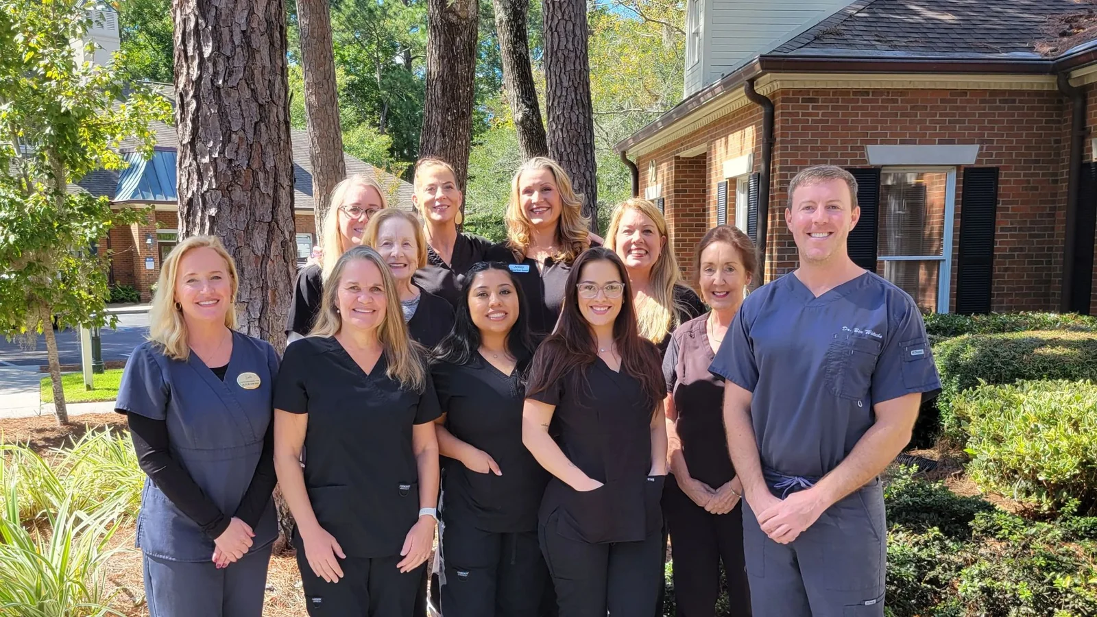 The Hilton Head Dental Team standing together outside their Main Street office